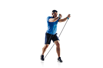 Image showing Caucasian professional male runner, athlete training isolated on white studio background. Copyspace for ad.