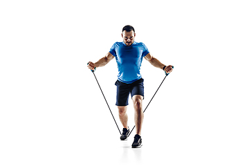 Image showing Caucasian professional male runner, athlete training isolated on white studio background. Copyspace for ad.