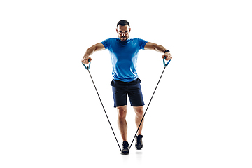 Image showing Caucasian professional male runner, athlete training isolated on white studio background. Copyspace for ad.