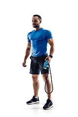 Image showing Caucasian professional male runner, athlete training isolated on white studio background. Copyspace for ad.