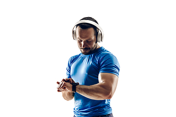 Image showing Caucasian professional male runner, athlete training isolated on white studio background. Copyspace for ad.