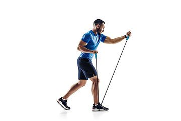 Image showing Caucasian professional male runner, athlete training isolated on white studio background. Copyspace for ad.