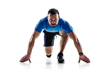 Image showing Caucasian professional male runner, athlete training isolated on white studio background. Copyspace for ad.