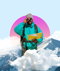 Image showing Happy man traveller looking through binoculars isolated on geometric background.