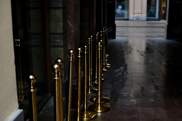 Image showing doorway in the city and gilt fence posts