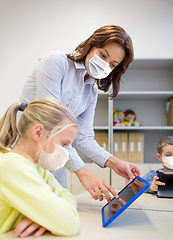 Image showing school teacher and student in masks with tablet pc