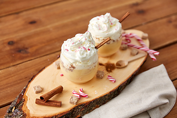 Image showing glasses of eggnog with whipped cream and anise