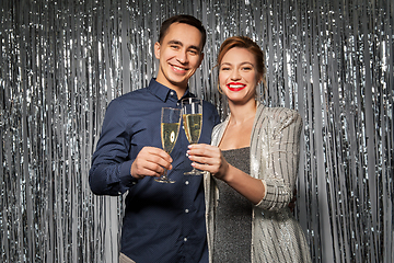 Image showing happy couple toasting champagne glasses at party