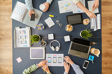 Image showing business team with gadgets working at office table