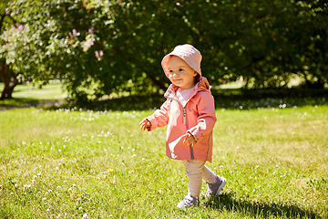 Image showing happy little baby girl walking at park in summer