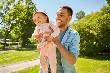 Image showing happy father with baby daughter at summer park