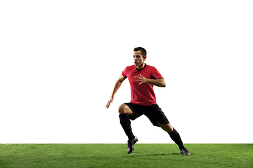 Image showing Young football, soccer player of team in action, motion isolated on white background. Concept of sport, movement, energy and dynamic.