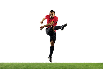 Image showing Young football, soccer player of team in action, motion isolated on white background. Concept of sport, movement, energy and dynamic.