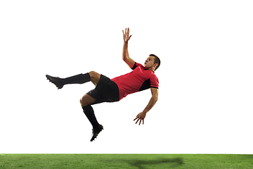 Image showing Young football, soccer player of team in action, motion isolated on white background. Concept of sport, movement, energy and dynamic.