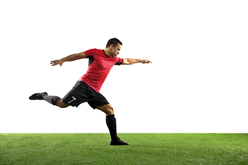 Image showing Young football, soccer player of team in action, motion isolated on white background. Concept of sport, movement, energy and dynamic.