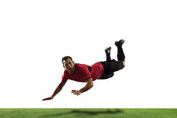 Image showing Young football, soccer player of team in action, motion isolated on white background. Concept of sport, movement, energy and dynamic.