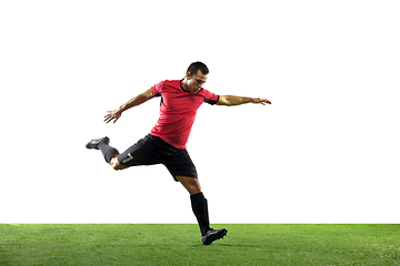 Image showing Young football, soccer player of team in action, motion isolated on white background. Concept of sport, movement, energy and dynamic.