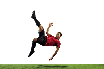 Image showing Young football, soccer player of team in action, motion isolated on white background. Concept of sport, movement, energy and dynamic.