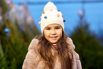 Image showing portrait of little girl at christmas tree market