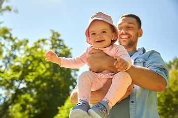 Image showing happy father with baby daughter at summer park