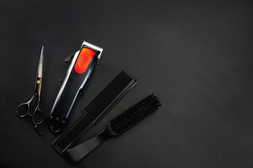 Image showing Barber shop equipment set isolated on black table background.