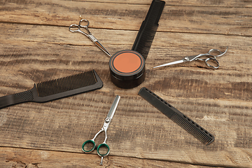 Image showing Barber shop equipment set isolated on wooden table background.