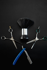 Image showing Barber shop equipment set isolated on black table background.