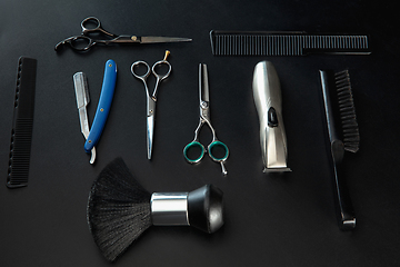 Image showing Barber shop equipment set isolated on black table background.