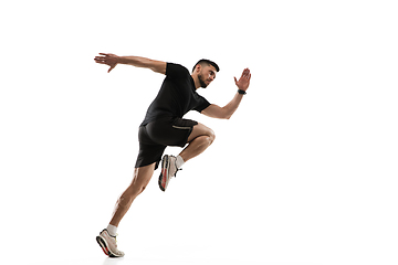 Image showing Caucasian professional sportsman training isolated on white studio background. Muscular, sportive man practicing.