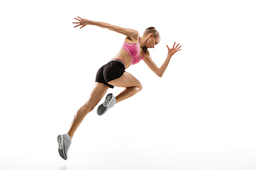 Image showing Caucasian professional female runner, athlete training isolated on white studio background. Copyspace for ad.