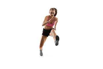 Image showing Caucasian professional female runner, athlete training isolated on white studio background. Copyspace for ad.