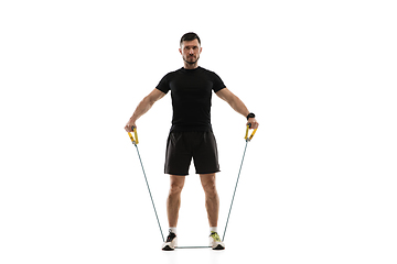 Image showing Caucasian professional sportsman training isolated on white studio background. Muscular, sportive man practicing.