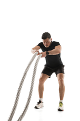 Image showing Caucasian professional sportsman training isolated on white studio background. Muscular, sportive man practicing.