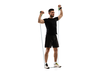 Image showing Caucasian professional sportsman training isolated on white studio background. Muscular, sportive man practicing.