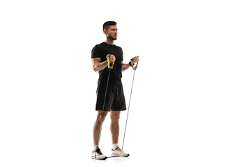 Image showing Caucasian professional sportsman training isolated on white studio background. Muscular, sportive man practicing.