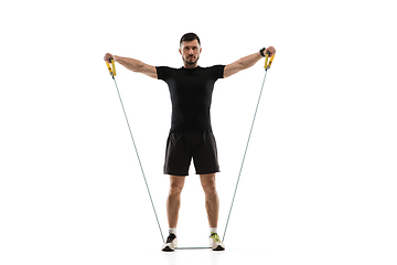 Image showing Caucasian professional sportsman training isolated on white studio background. Muscular, sportive man practicing.