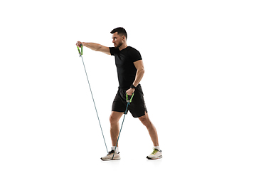 Image showing Caucasian professional sportsman training isolated on white studio background. Muscular, sportive man practicing.