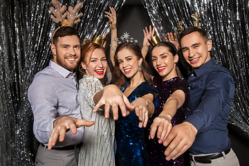 Image showing happy friends posing at christmas party