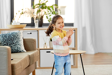 Image showing happy smiling little girl at home