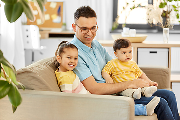 Image showing happy father with little children at home