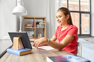 Image showing student girl with tablet pc learning at home