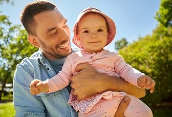 Image showing happy father with baby daughter at summer park