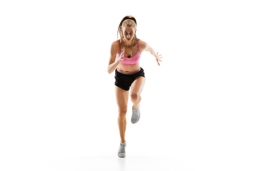 Image showing Caucasian professional female runner, athlete training isolated on white studio background. Copyspace for ad.