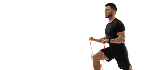 Image showing Caucasian professional sportsman training isolated on white studio background. Muscular, sportive man practicing.