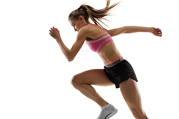 Image showing Caucasian professional female runner, athlete training isolated on white studio background. Copyspace for ad.