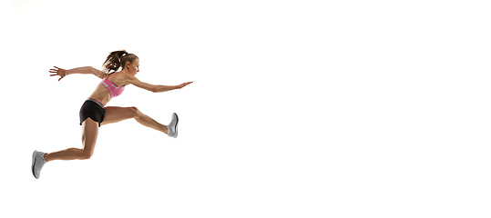 Image showing Caucasian professional female runner, athlete training isolated on white studio background. Copyspace for ad.