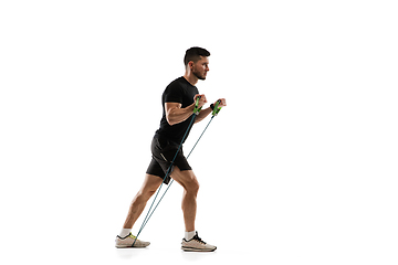 Image showing Caucasian professional sportsman training isolated on white studio background. Muscular, sportive man practicing.