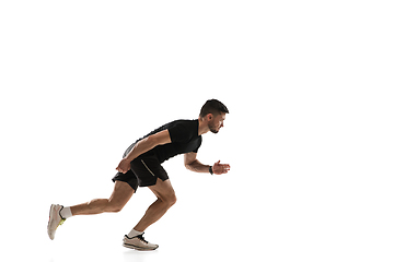 Image showing Caucasian professional sportsman training isolated on white studio background. Muscular, sportive man practicing.