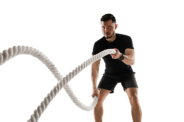 Image showing Caucasian professional sportsman training isolated on white studio background. Muscular, sportive man practicing.