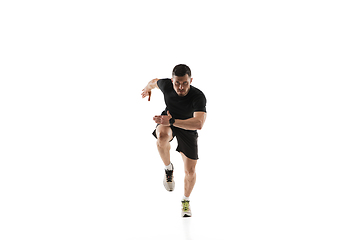 Image showing Caucasian professional sportsman training isolated on white studio background. Muscular, sportive man practicing.